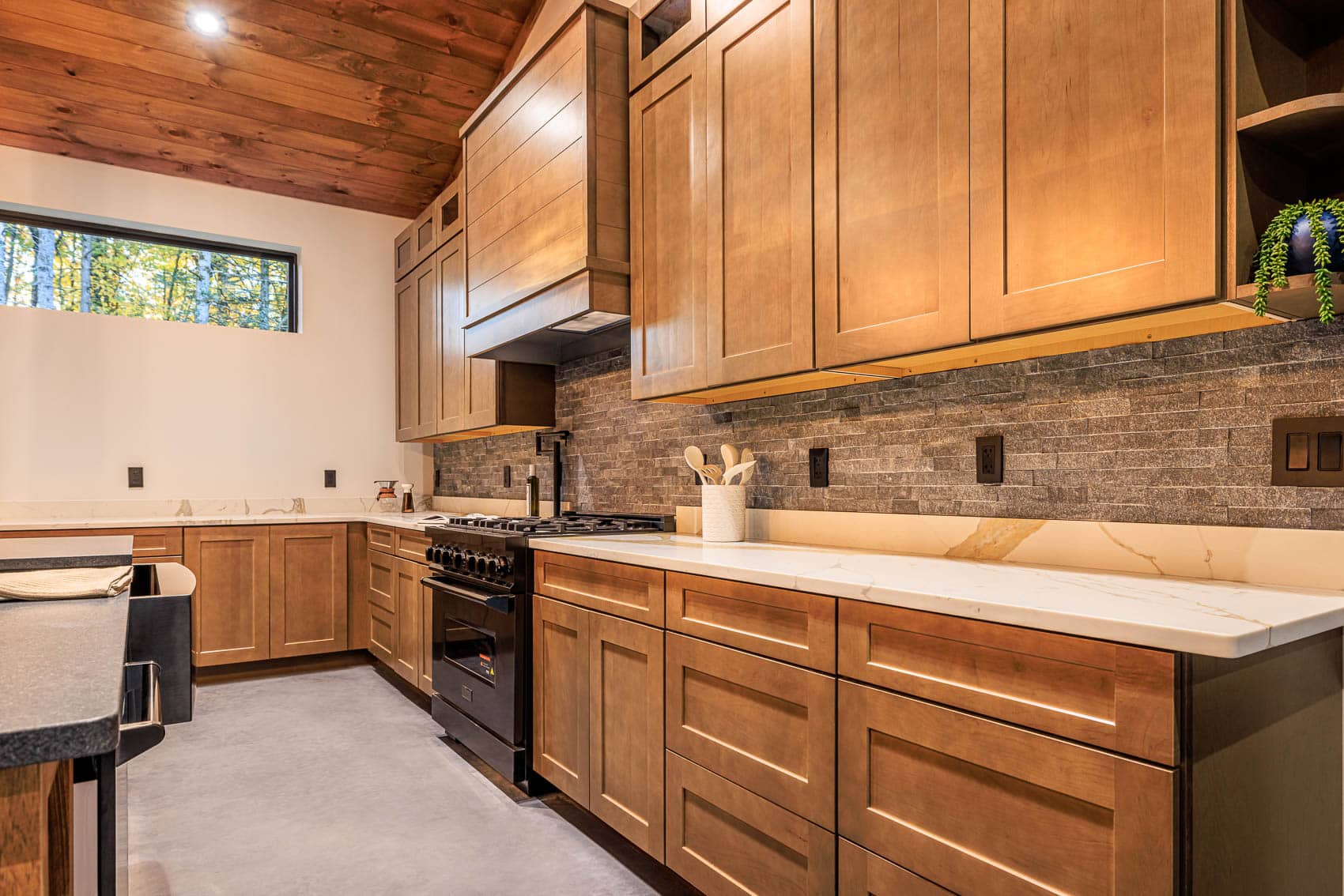 Custom wood kitchen cabinetry inside barndominium home