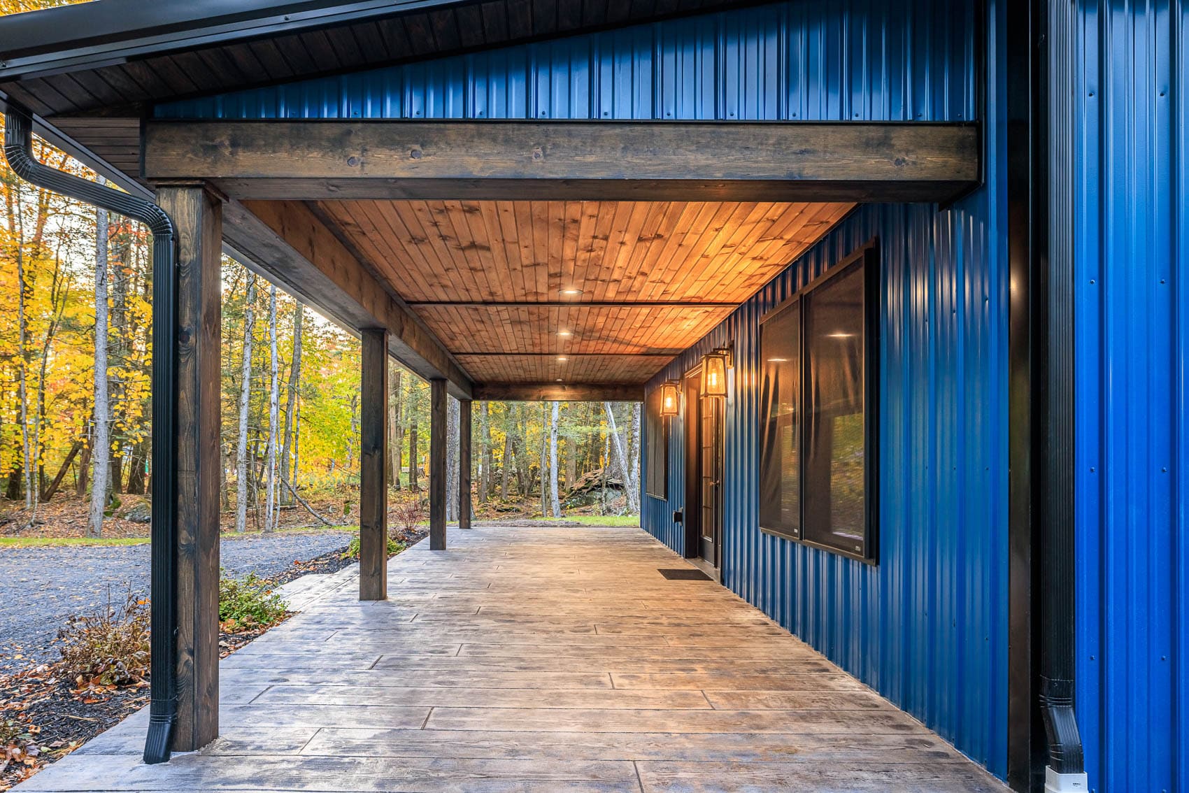 Covered porch with timber posts and wood ceiling